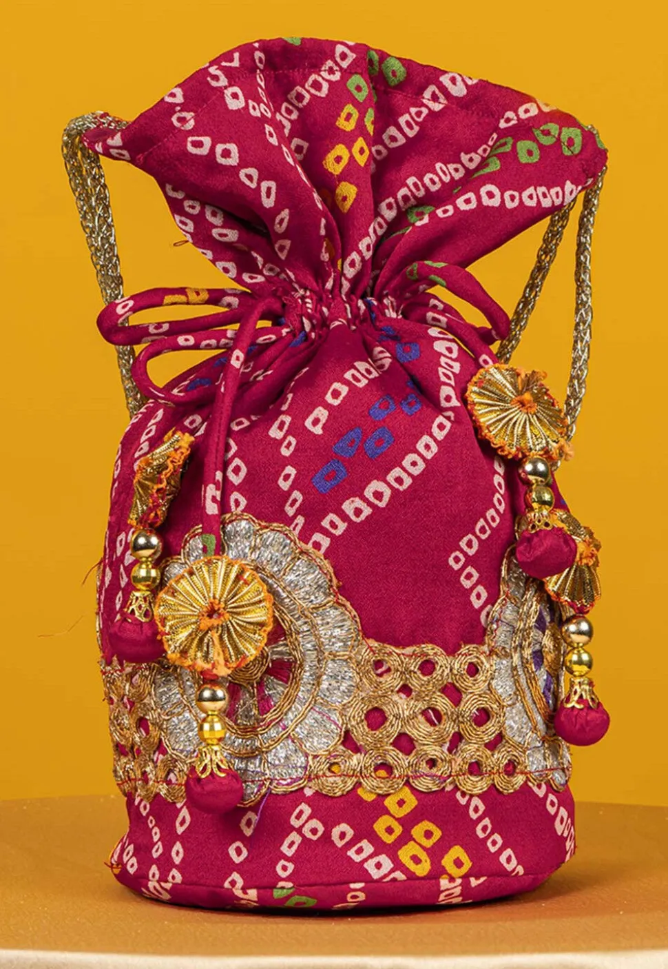 Bandhej Printed Crepe Potli Bag in Fuchsia