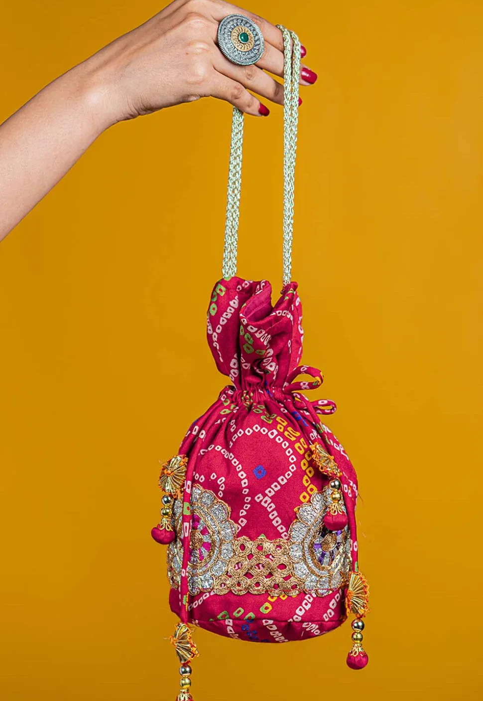 Bandhej Printed Crepe Potli Bag in Fuchsia