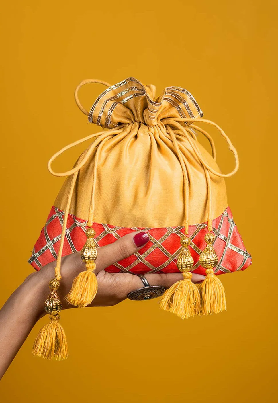 Embellished Art Silk Potli Bag in Yellow and Orange