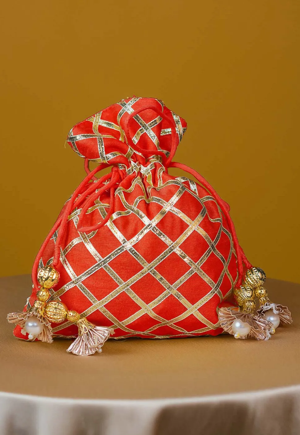 Embroidered Art Silk Potli Bag in Orange