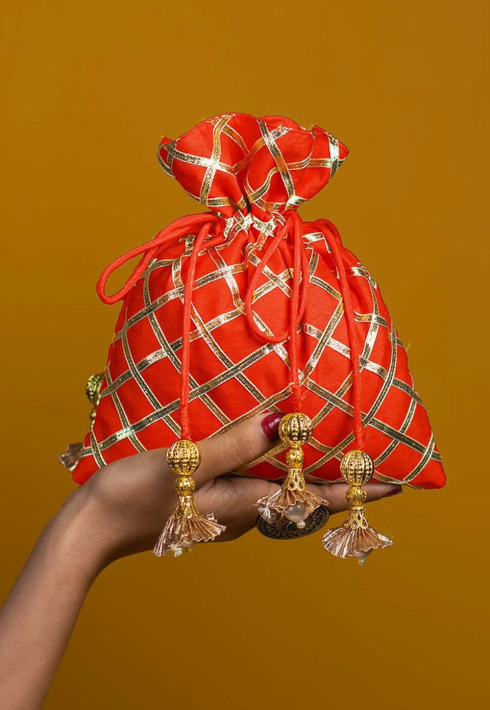 Embroidered Art Silk Potli Bag in Orange