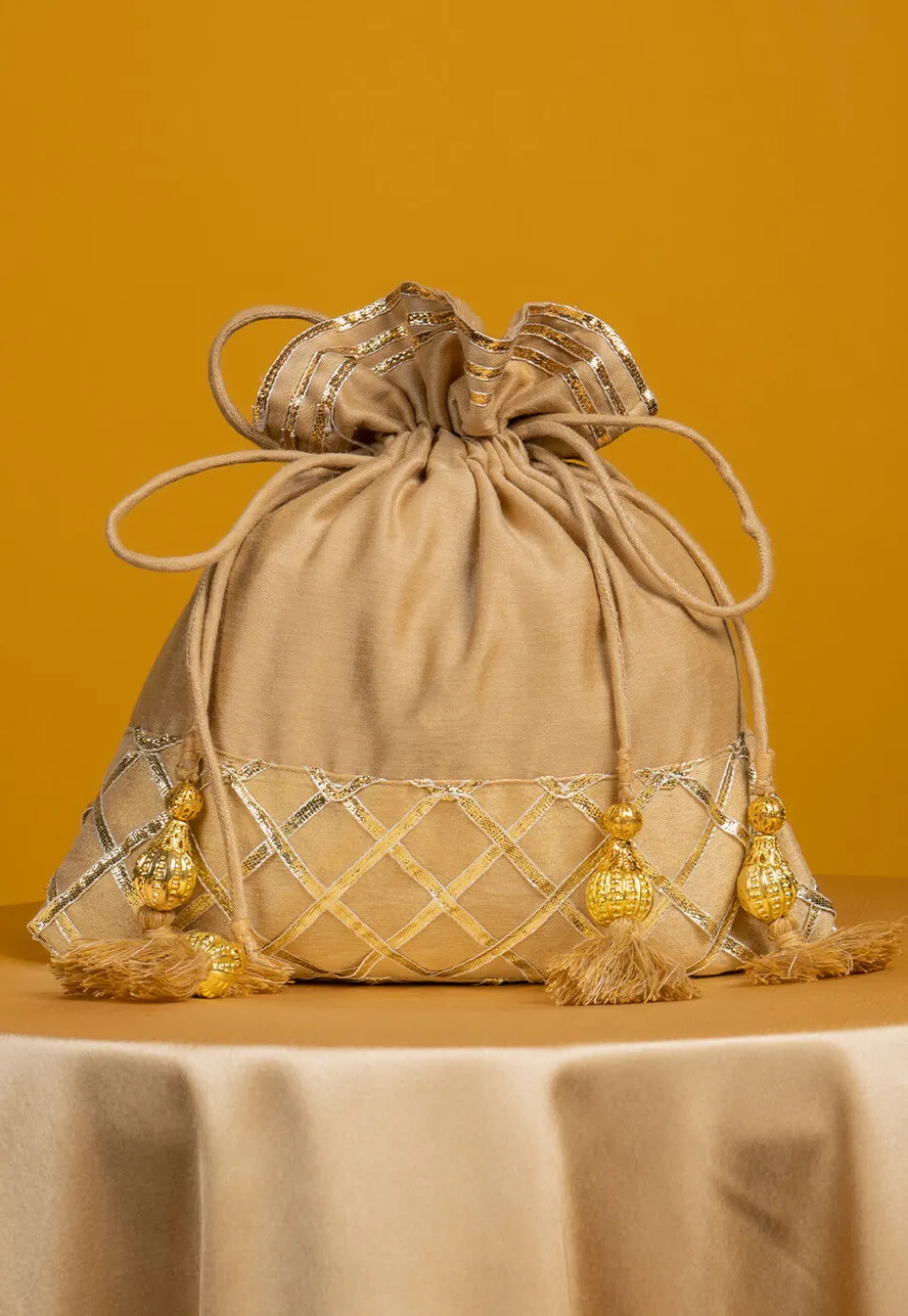 Embroidered Art Silk Potli Bag in Beige