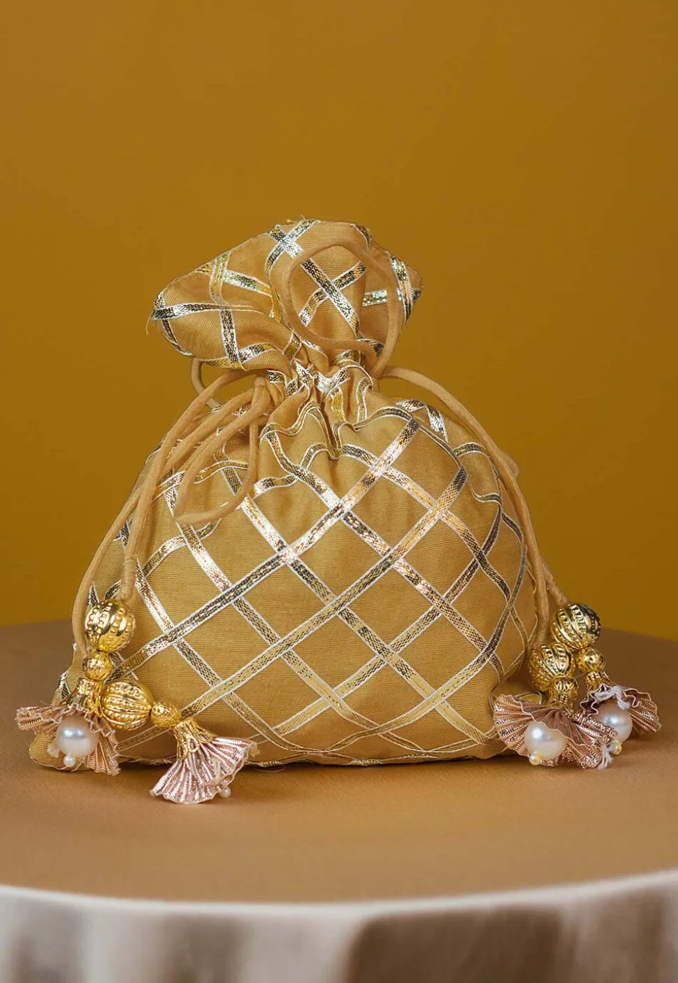 Embroidered Art Silk Potli Bag in Beige