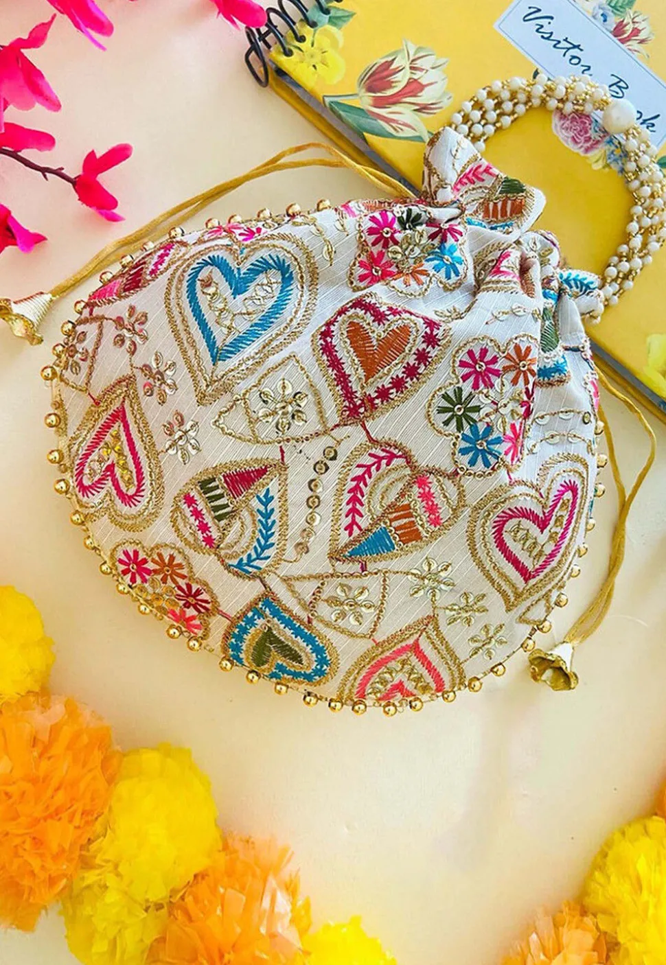 Embroidered Art Silk Potli Bag in Off White