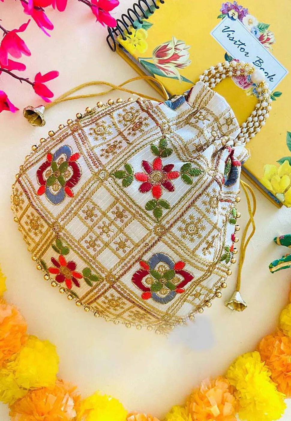Embroidered Art Silk Potli Bag in Off White