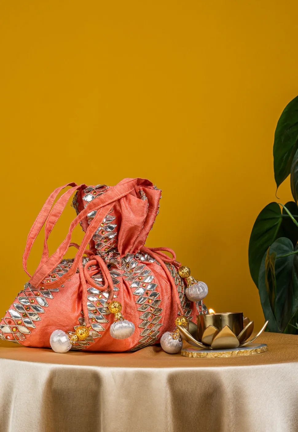 Embroidered Art Silk Potli Bag in Peach