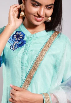 Embroidered Art Silk Straight Suit in Turquoise