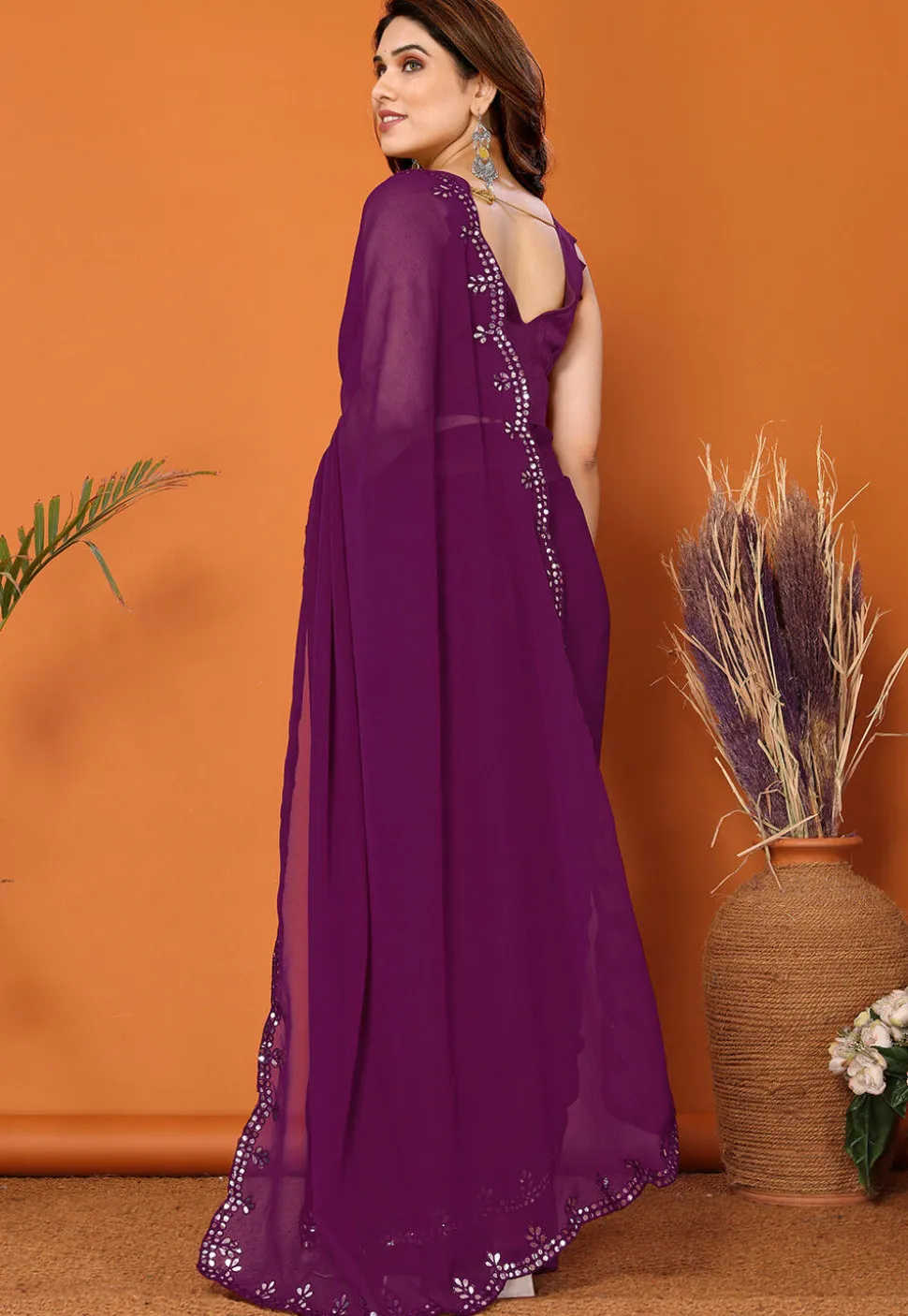 Embroidered Border Georgette Saree in Dark Purple