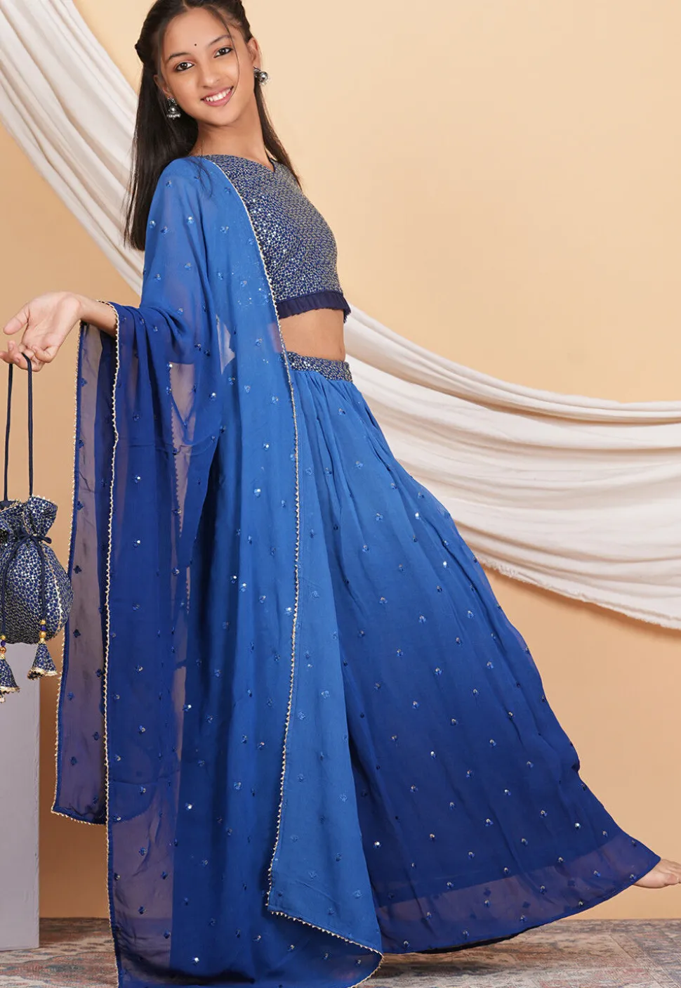 Embroidered Georgette Knife Pleated Lehenga in Shaded Blue