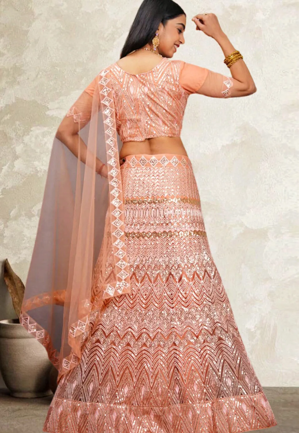 Embroidered Net Lehenga in Peach