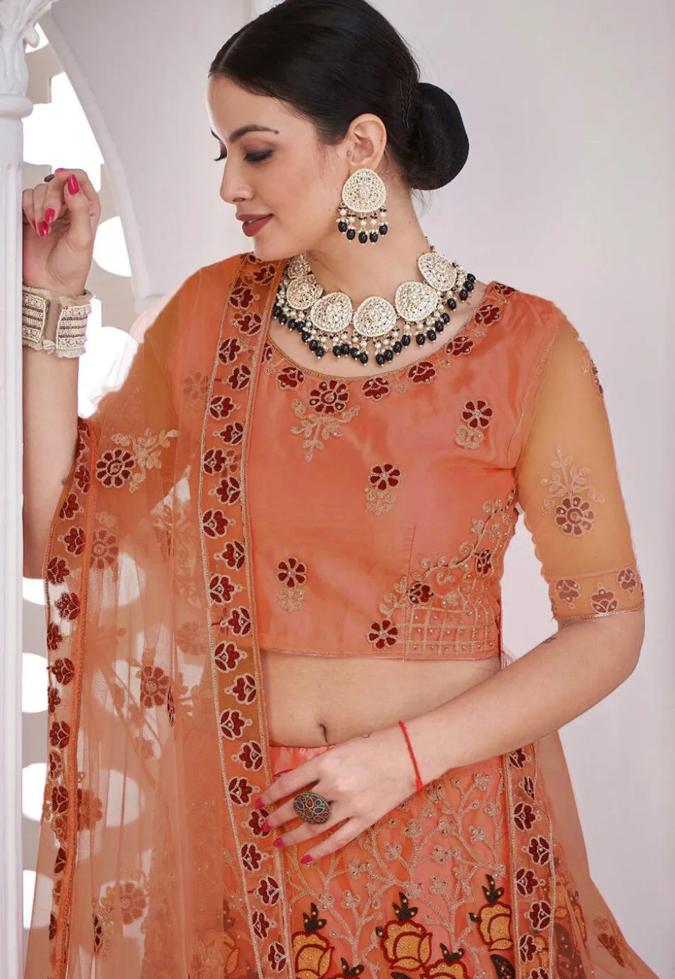 Embroidered Net Lehenga in Peach