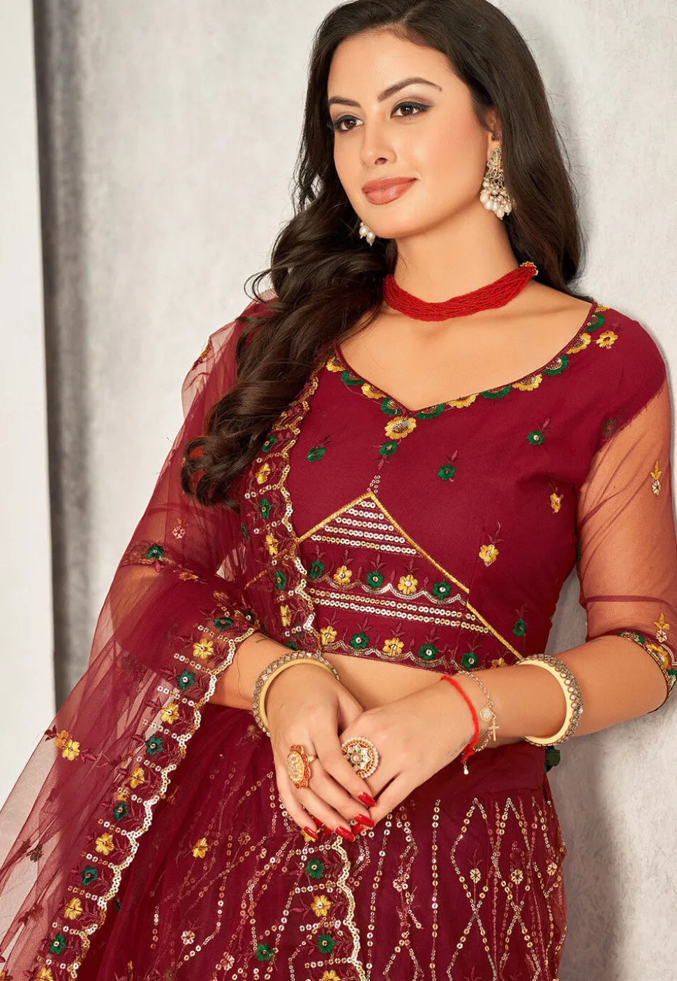 Embroidered Net Lehenga in Maroon