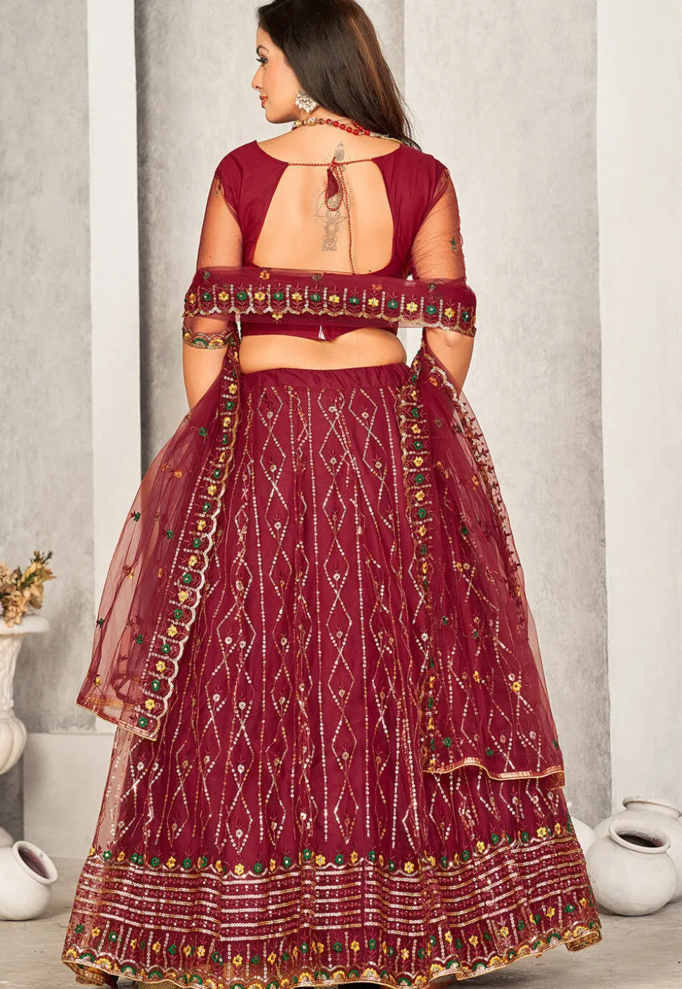 Embroidered Net Lehenga in Maroon