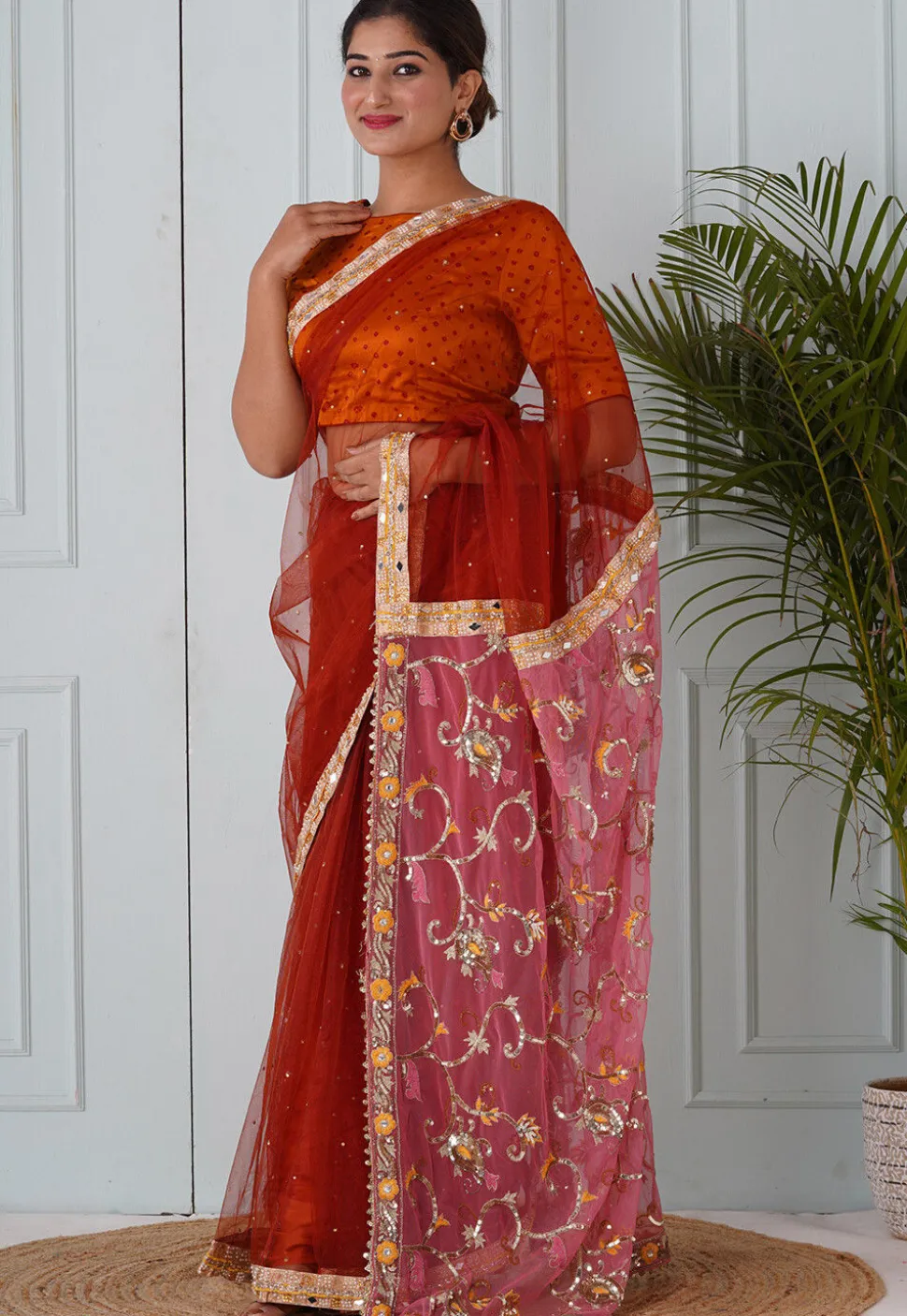 Embroidered Net Saree in Rust and Pink