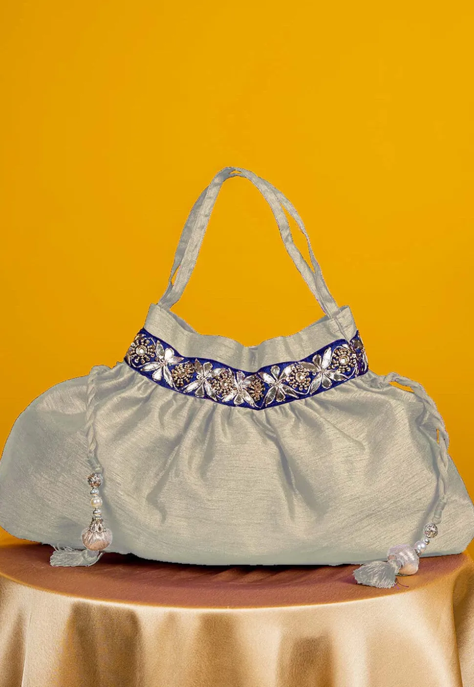 Gota Patti Art Silk Potli Bag in Off White