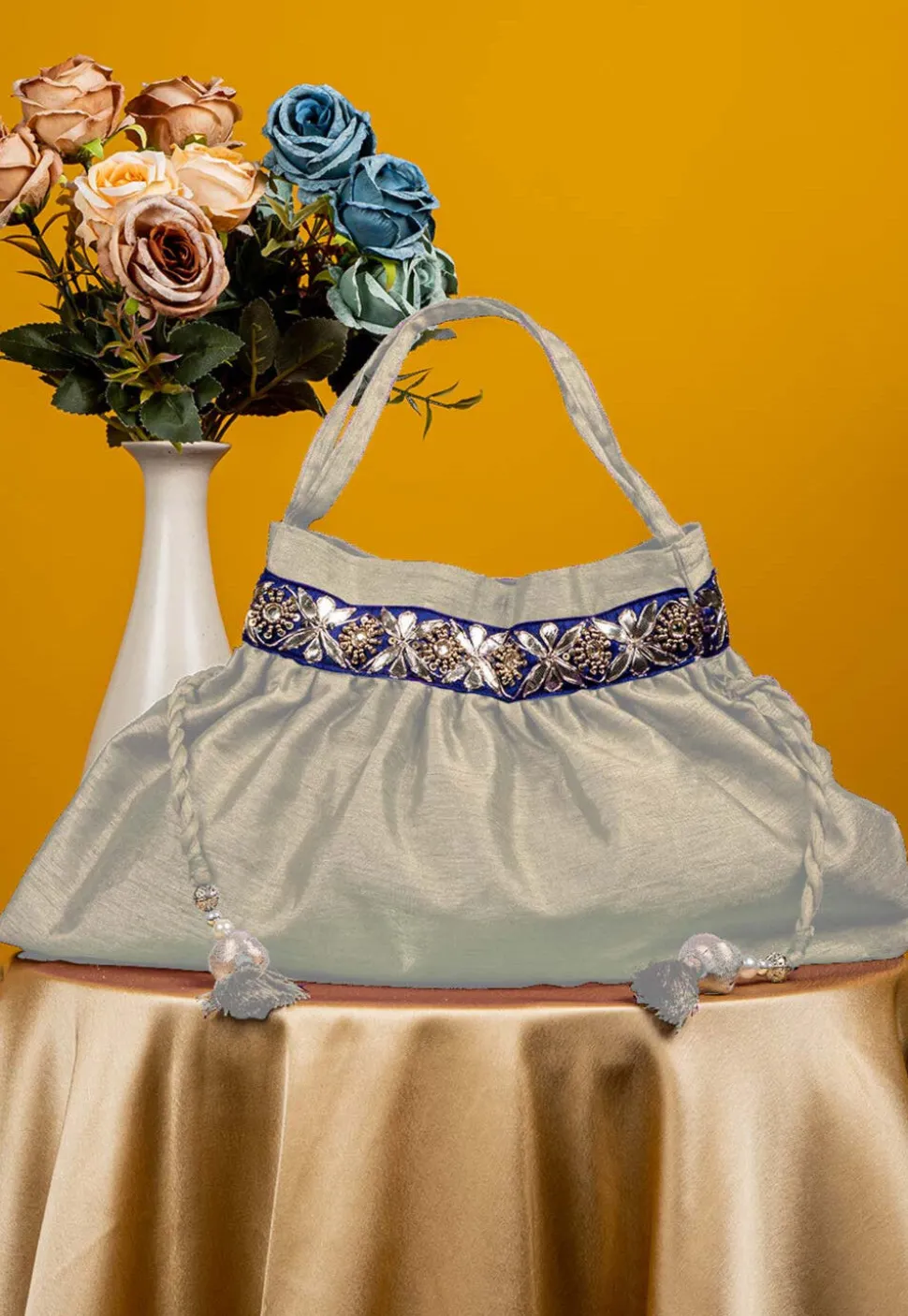 Gota Patti Art Silk Potli Bag in Off White