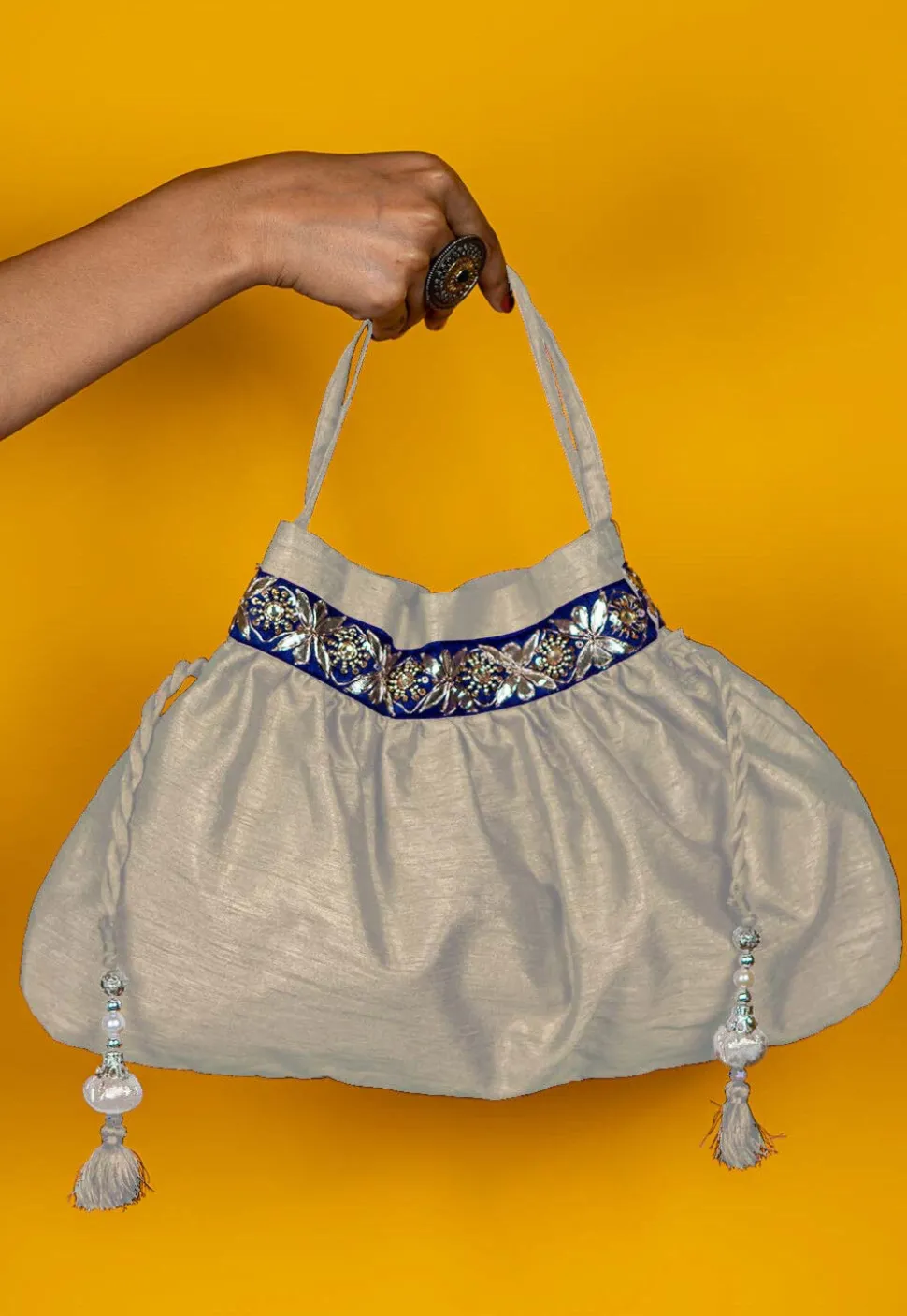Gota Patti Art Silk Potli Bag in Off White