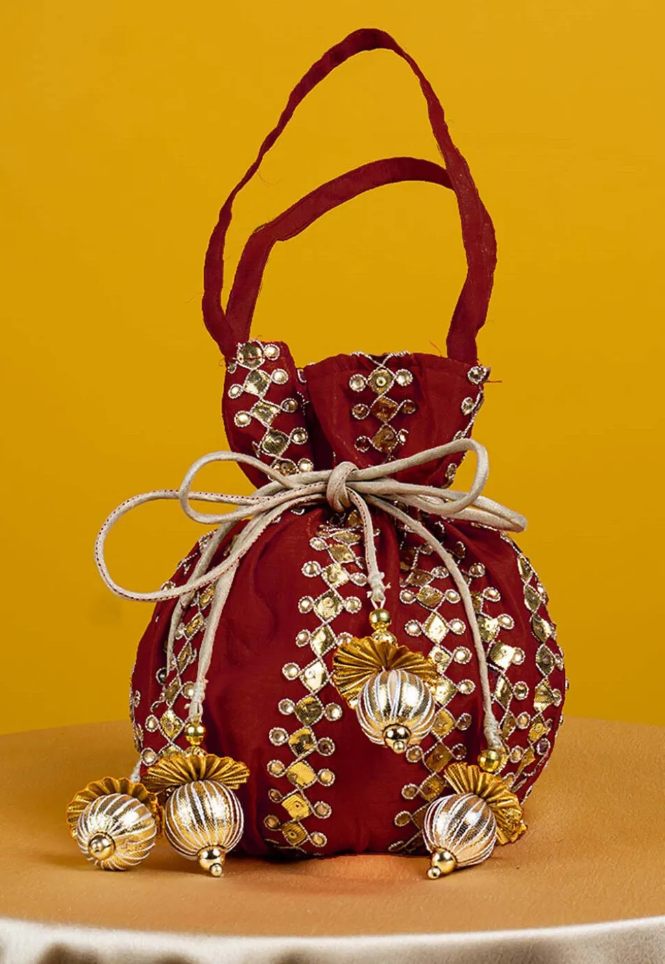 Gota Patti Art Silk Potli Bag in Maroon