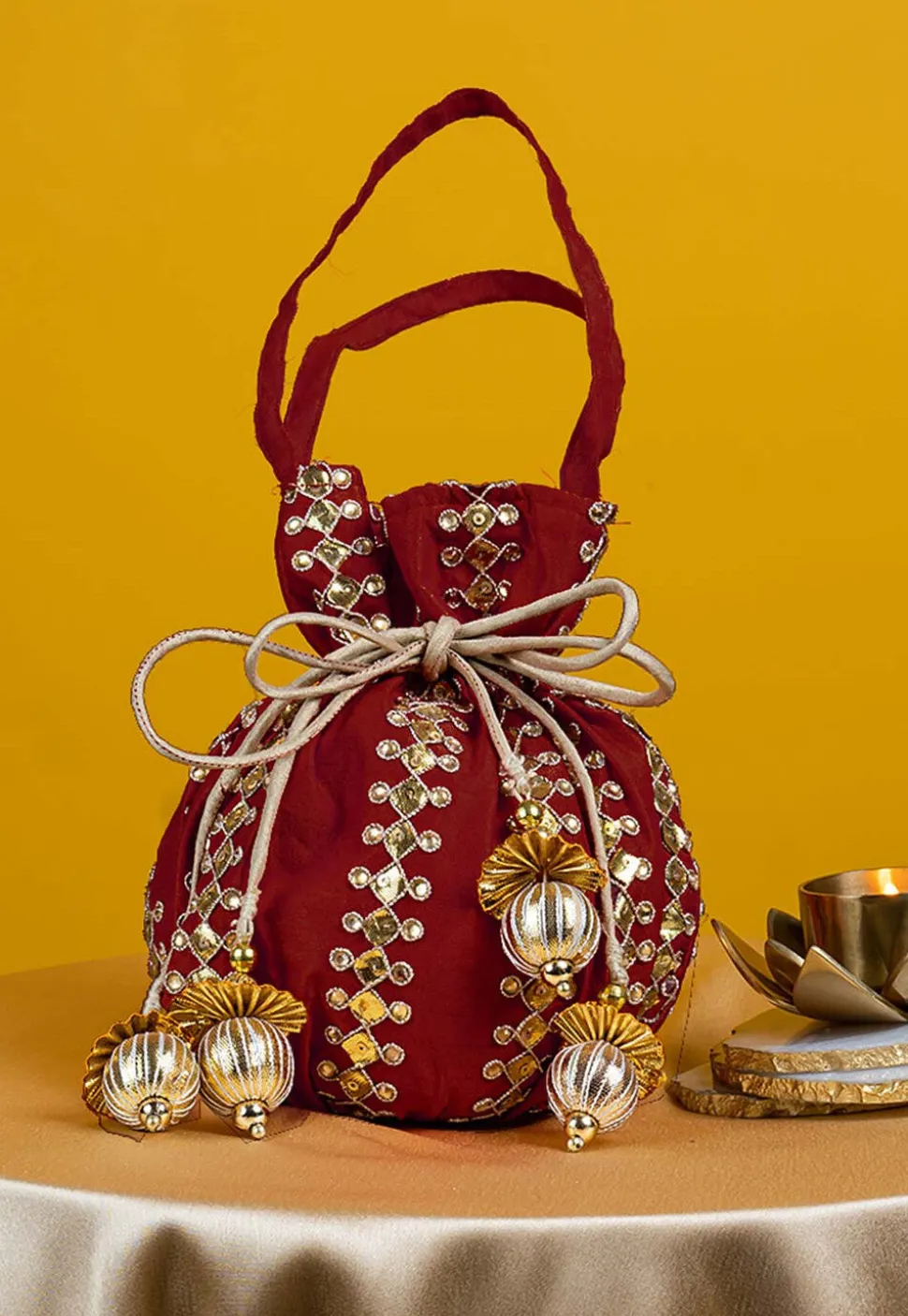 Gota Patti Art Silk Potli Bag in Maroon