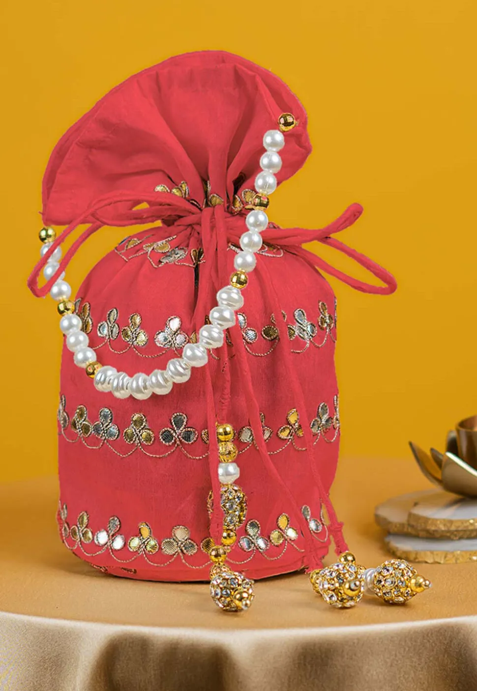 Gota Patti Art Silk Potli Bag in Peach