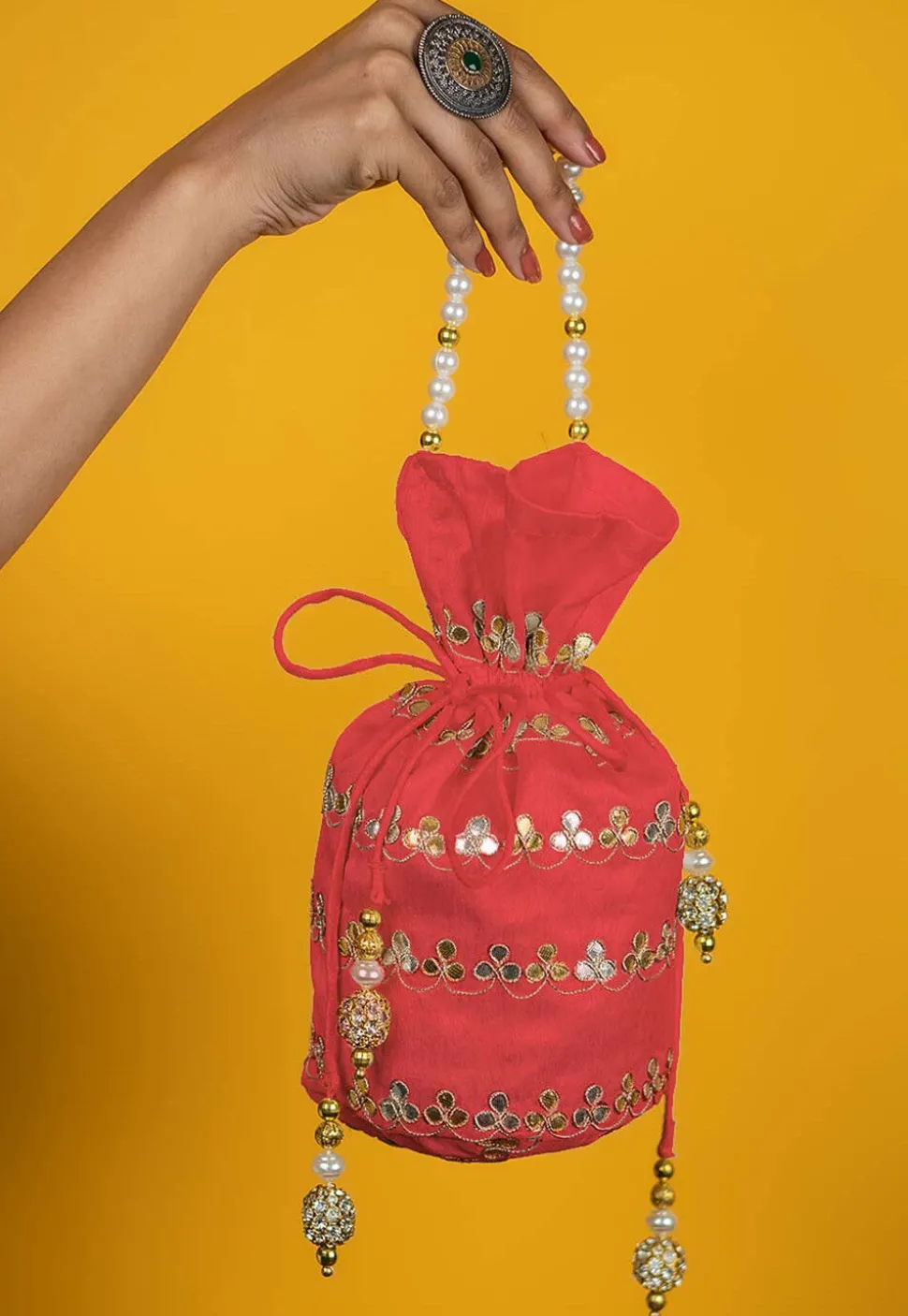 Gota Patti Art Silk Potli Bag in Peach