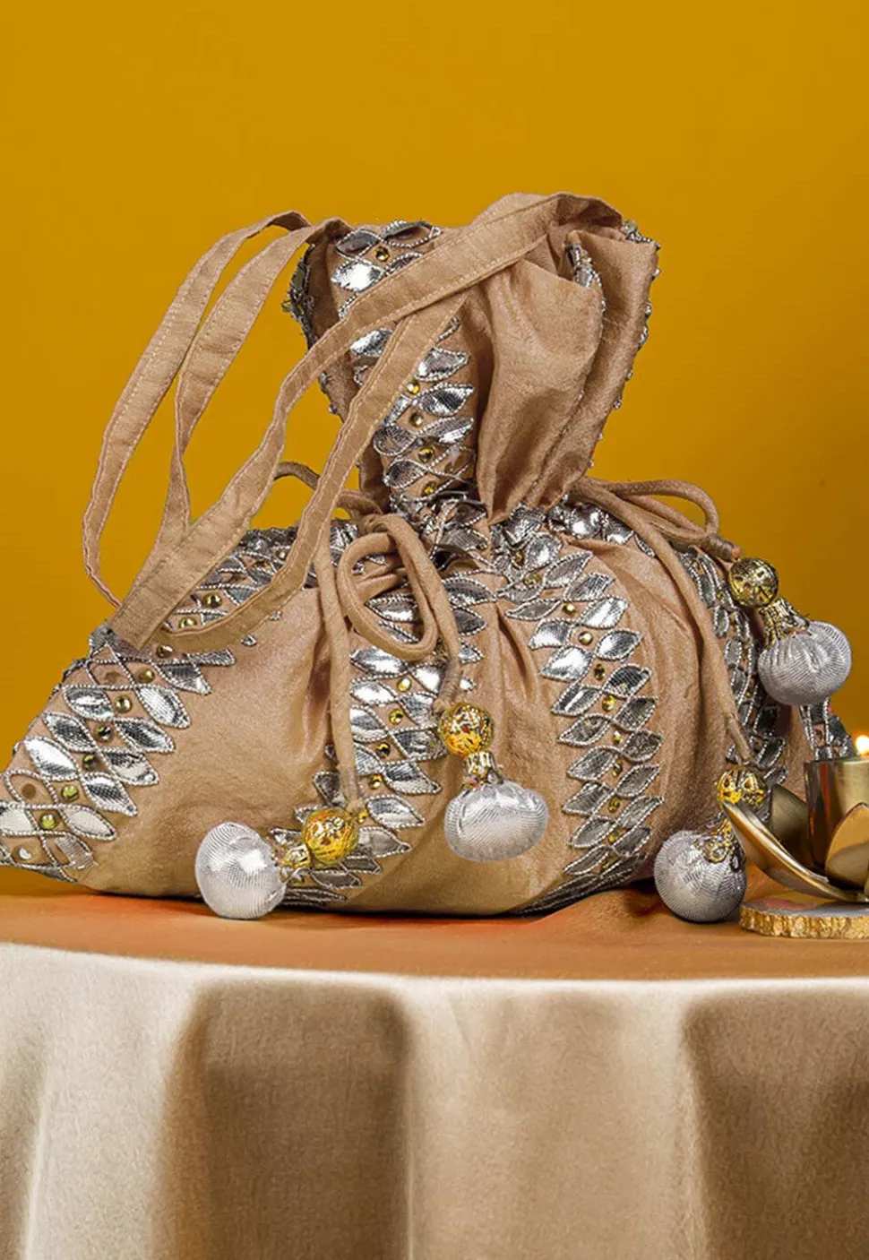 Gota Patti Art Silk Potli Bag in Beige