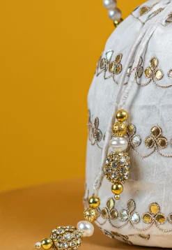 Gota Patti Art Silk Potli Bag in Off White