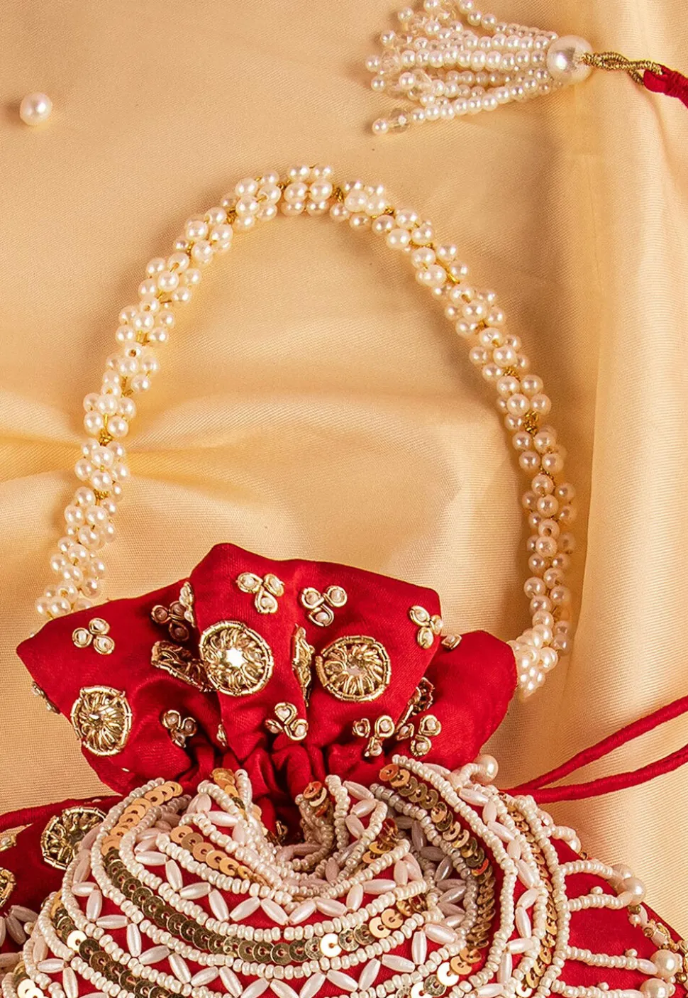 Hand Embroidered Art Silk Potli Bag in Red