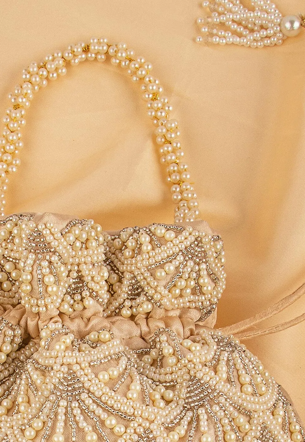 Hand Embroidered Art Silk Potli Bag in Beige