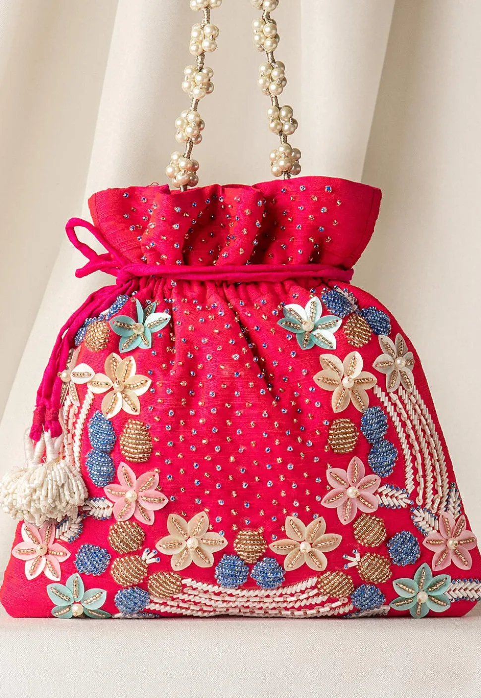 Hand Embroidered Art Silk Potli Bag in Fuchsia