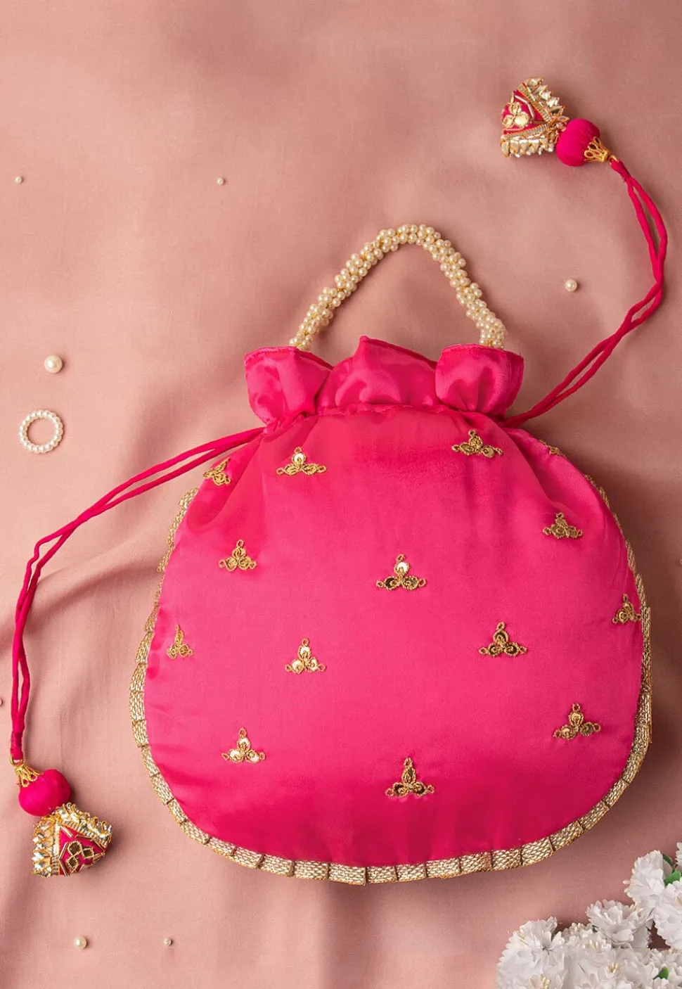 Hand Embroidered Art Silk Potli Bag in Fuchsia