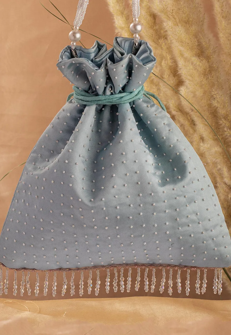 Hand Embroidered Art Silk Potli Bag in Pastel Blue