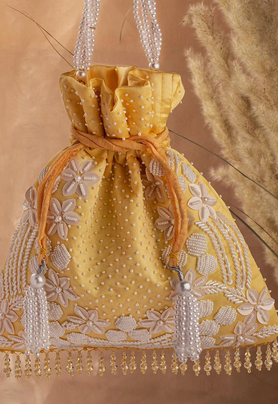 Hand Embroidered Art Silk Potli Bag in Mustard