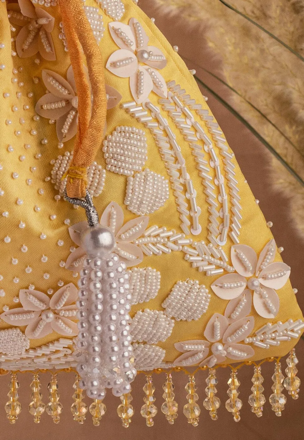 Hand Embroidered Art Silk Potli Bag in Mustard