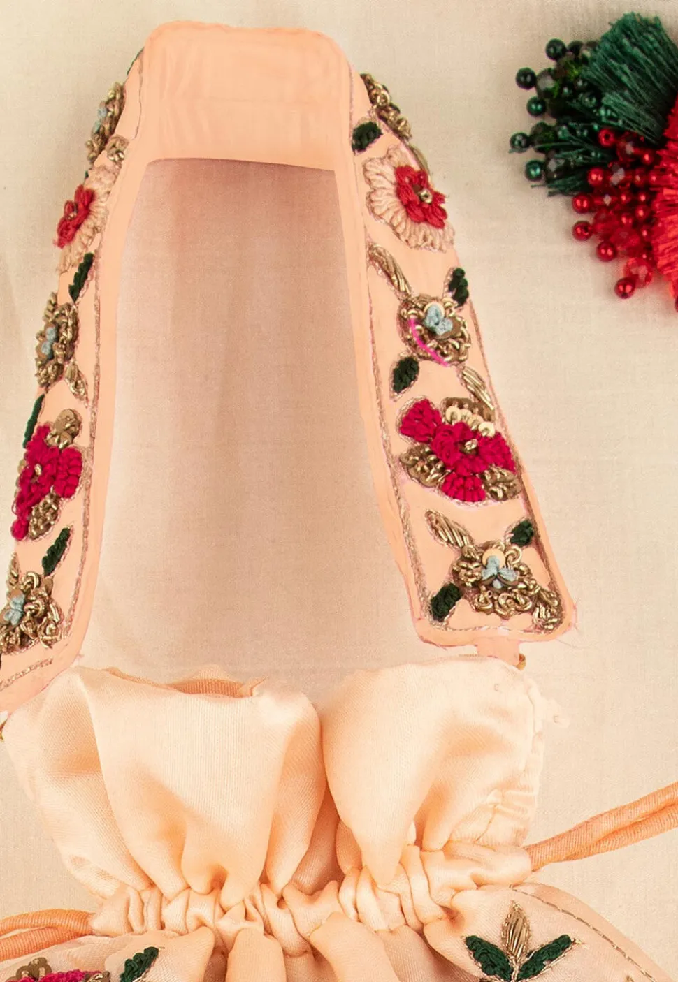 Hand Embroidered Art Silk Potli Bag in Peach