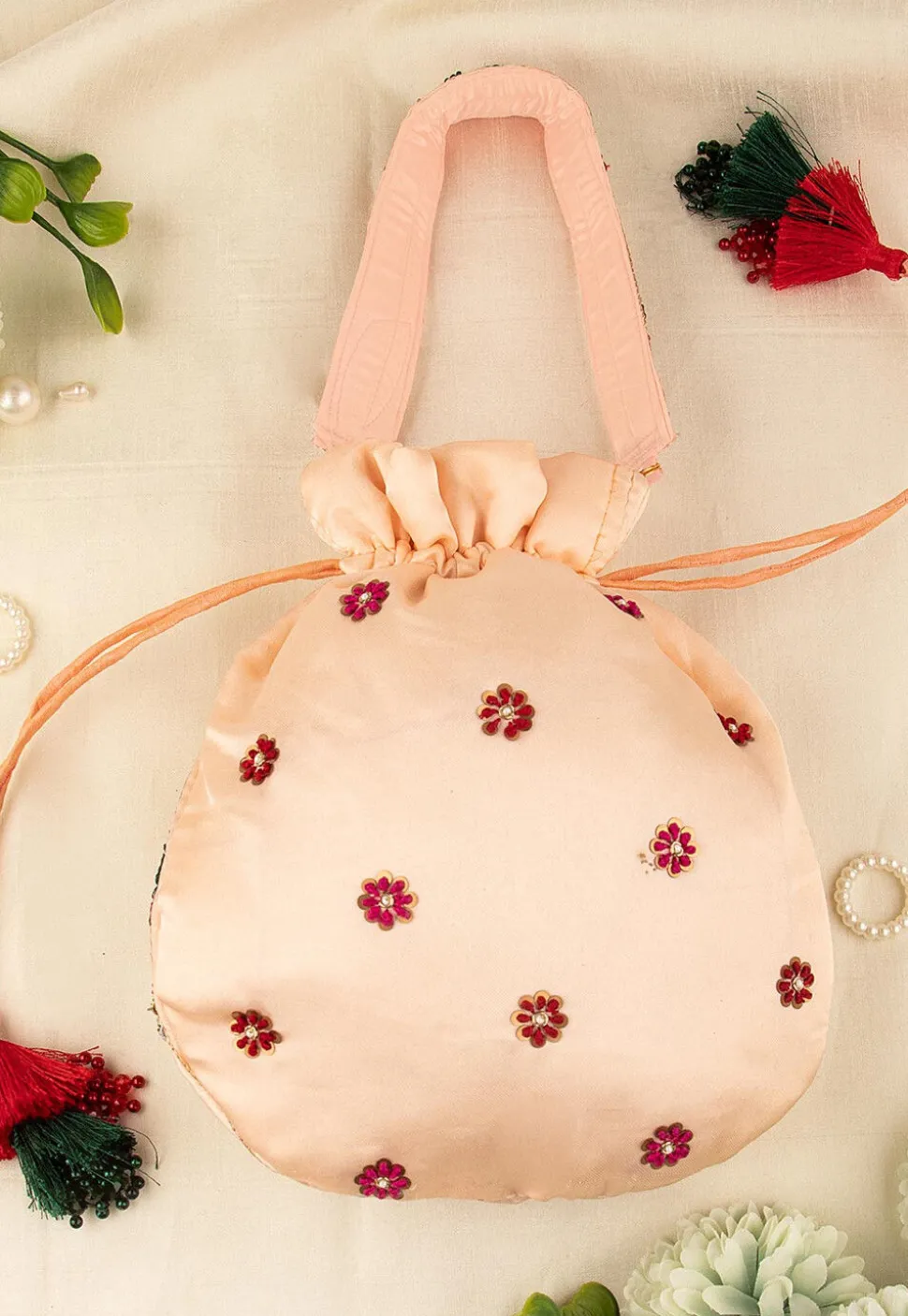 Hand Embroidered Art Silk Potli Bag in Peach