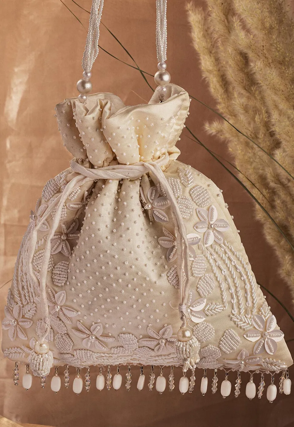 Hand Embroidered Art Silk Potli Bag in Off White