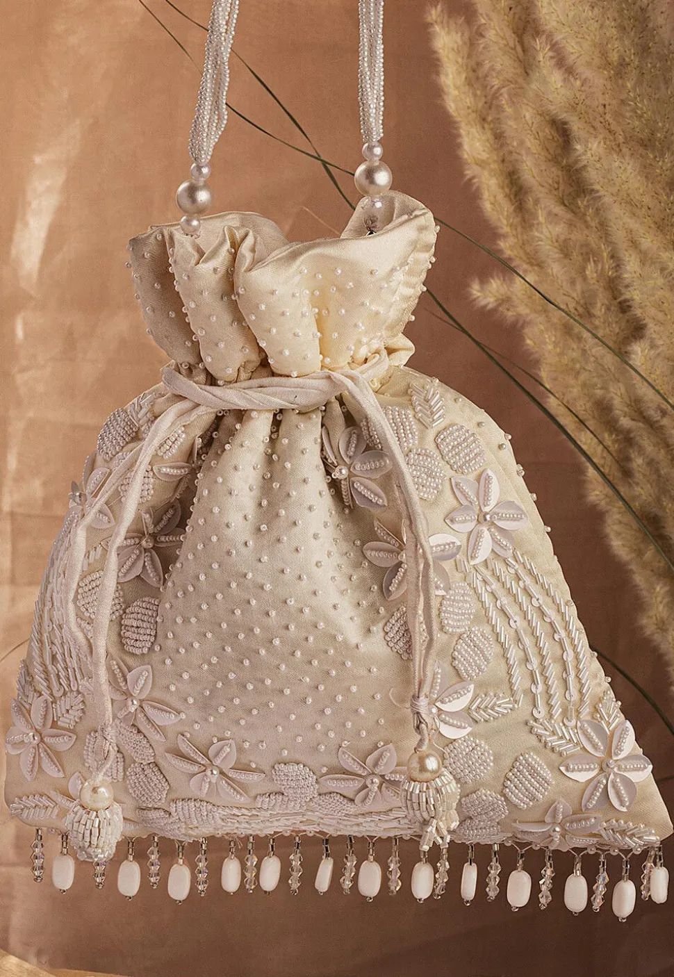 Hand Embroidered Art Silk Potli Bag in Cream