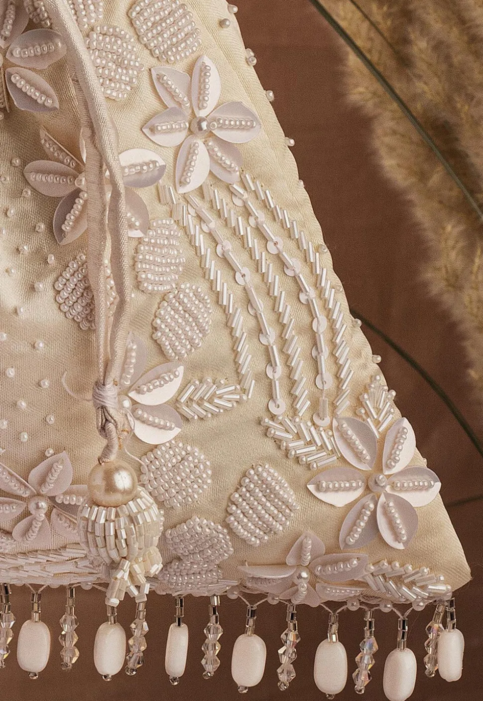 Hand Embroidered Art Silk Potli Bag in Cream