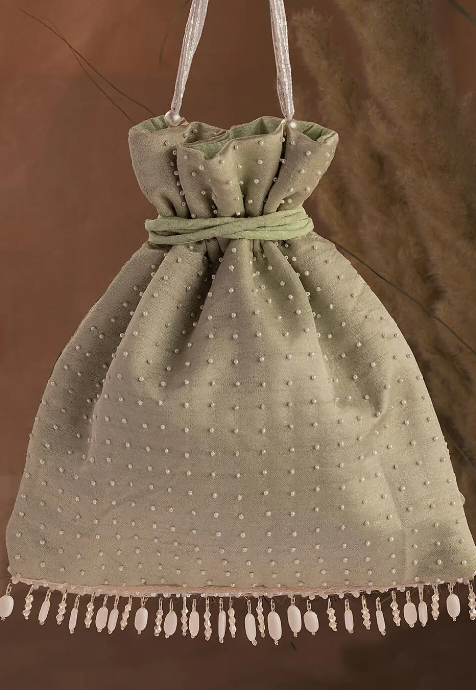 Hand Embroidered Art Silk Potli Bag in Pastel Green