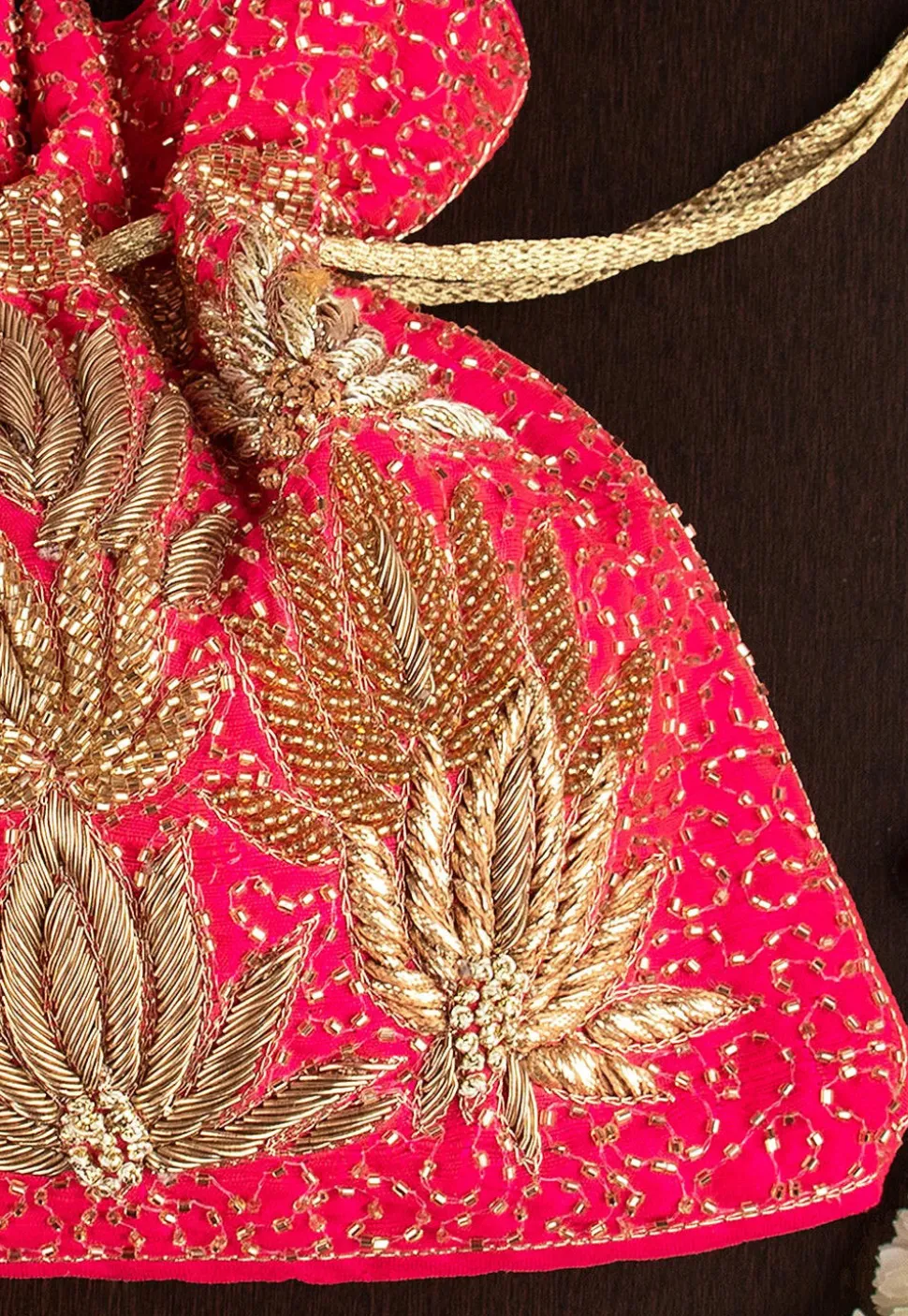 Hand Embroidered Art Silk Potli Bag in Fuchsia
