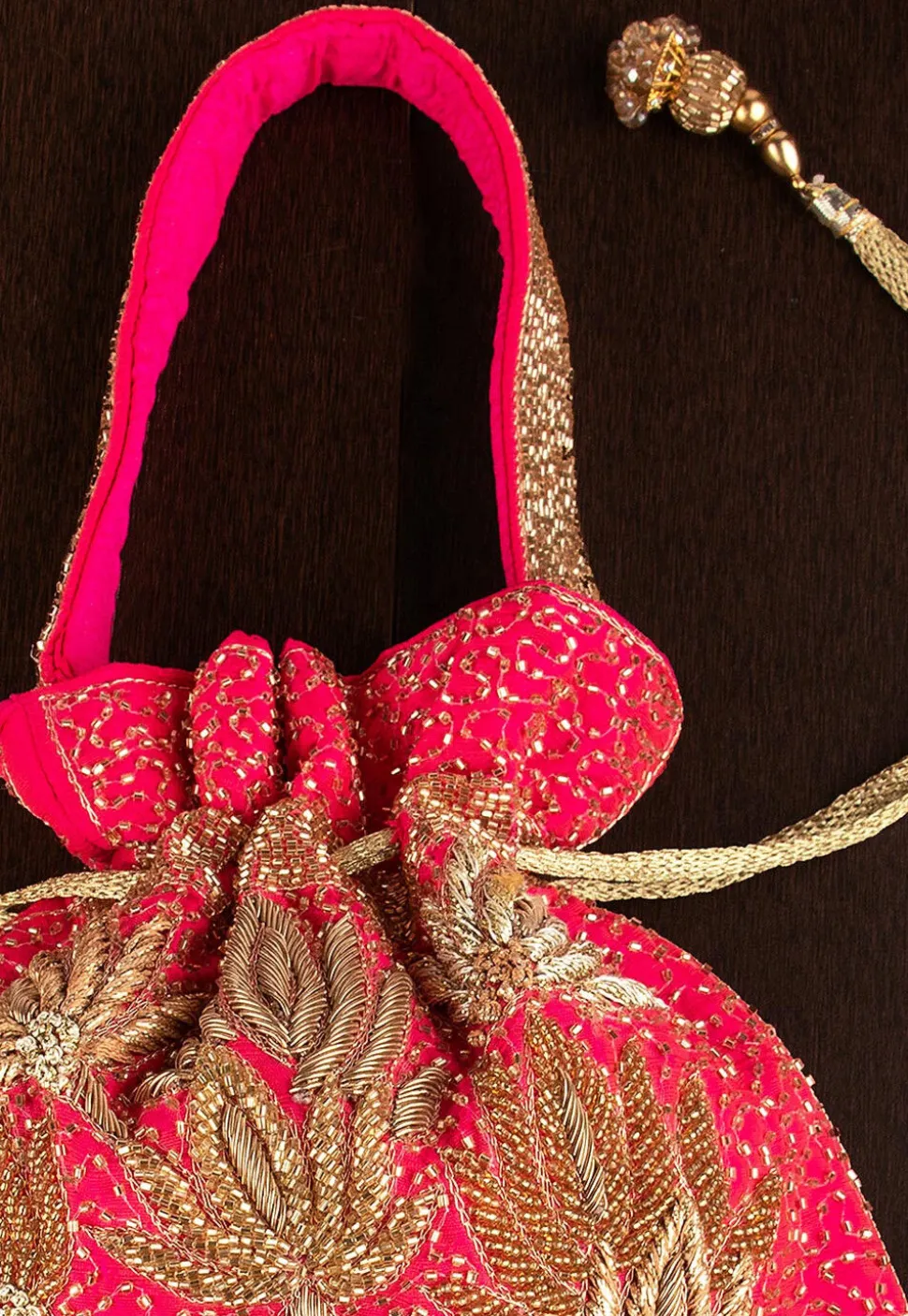 Hand Embroidered Art Silk Potli Bag in Fuchsia