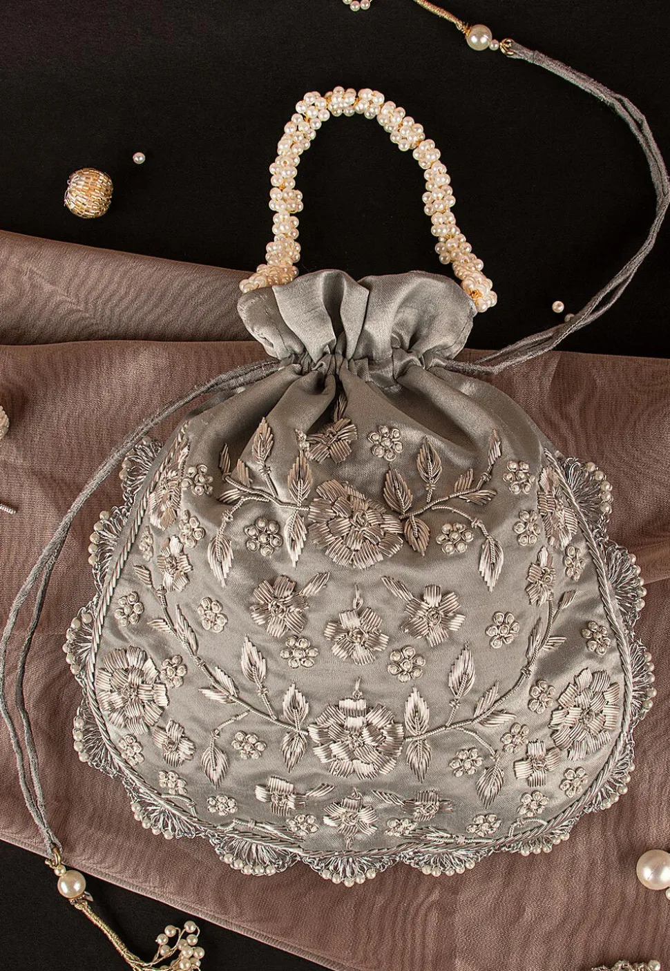 Hand Embroidered Art Silk Potli Bag in Silver