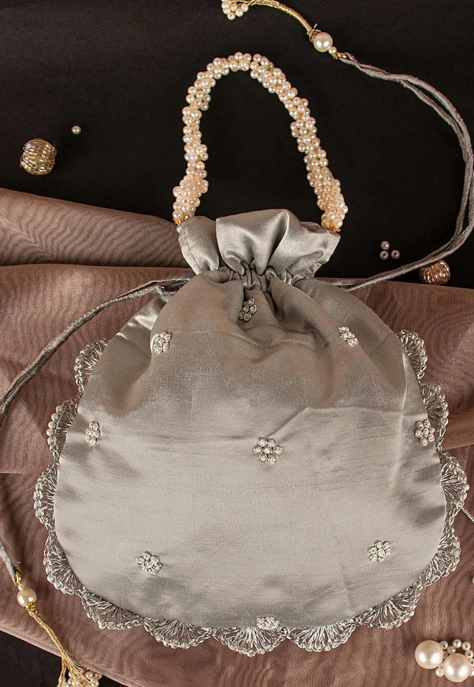 Hand Embroidered Art Silk Potli Bag in Silver