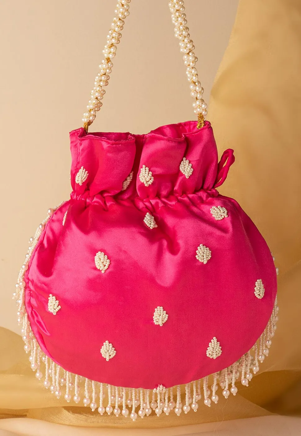 Hand Embroidered Art Silk Potli Bag in Fuchsia