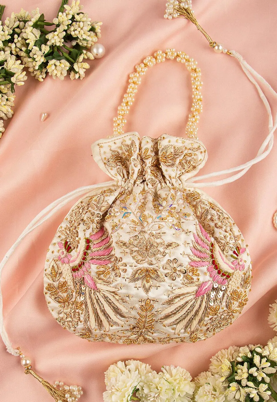 Hand Embroidered Art Silk Potli Bag in Off White