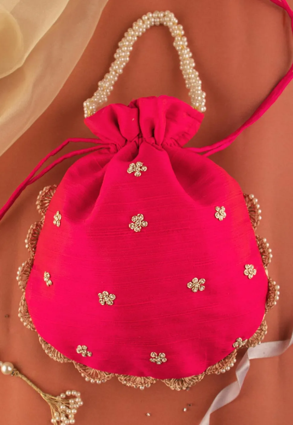 Hand Embroidered Art Silk Potli Bag in Fuchsia