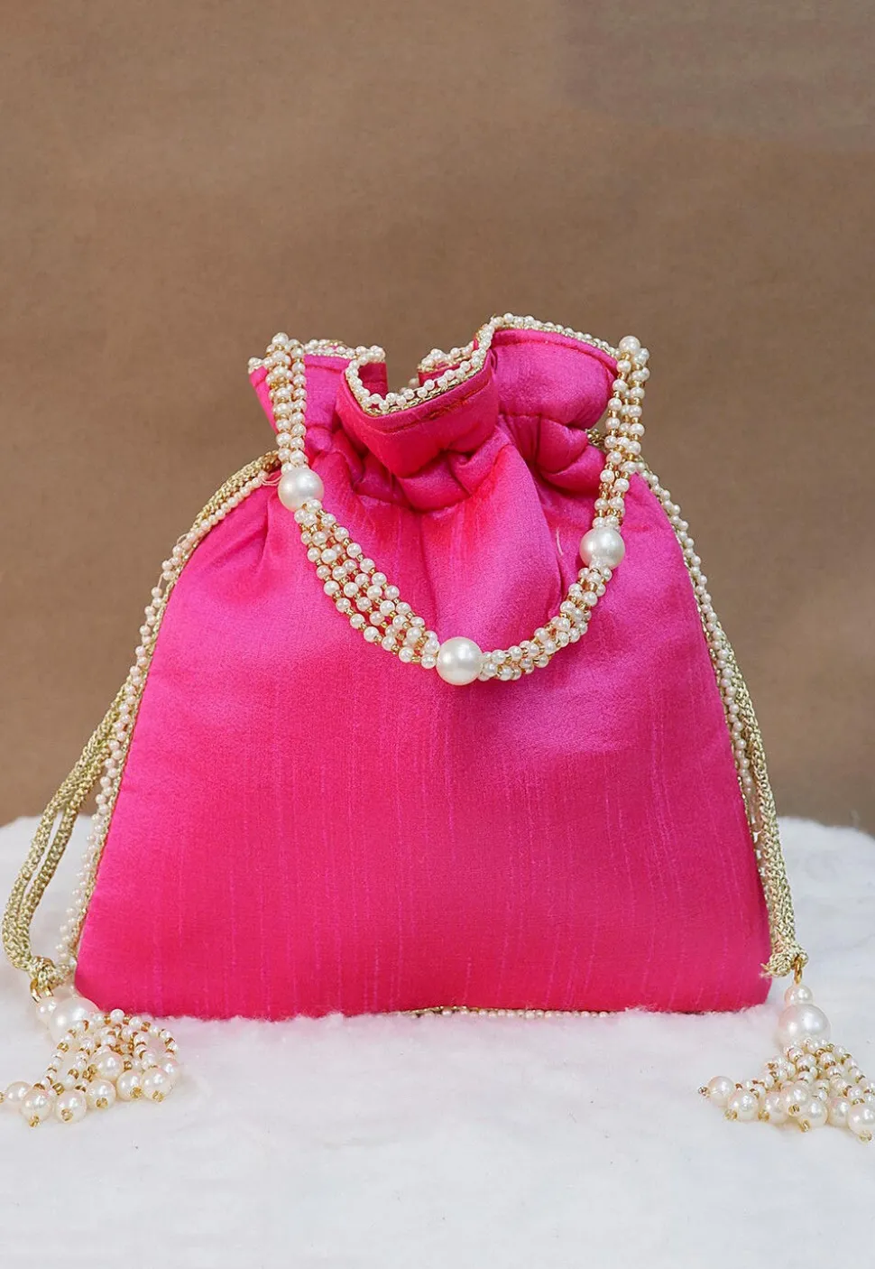 Hand Embroidered Art Silk Potli Bag in Fuchsia