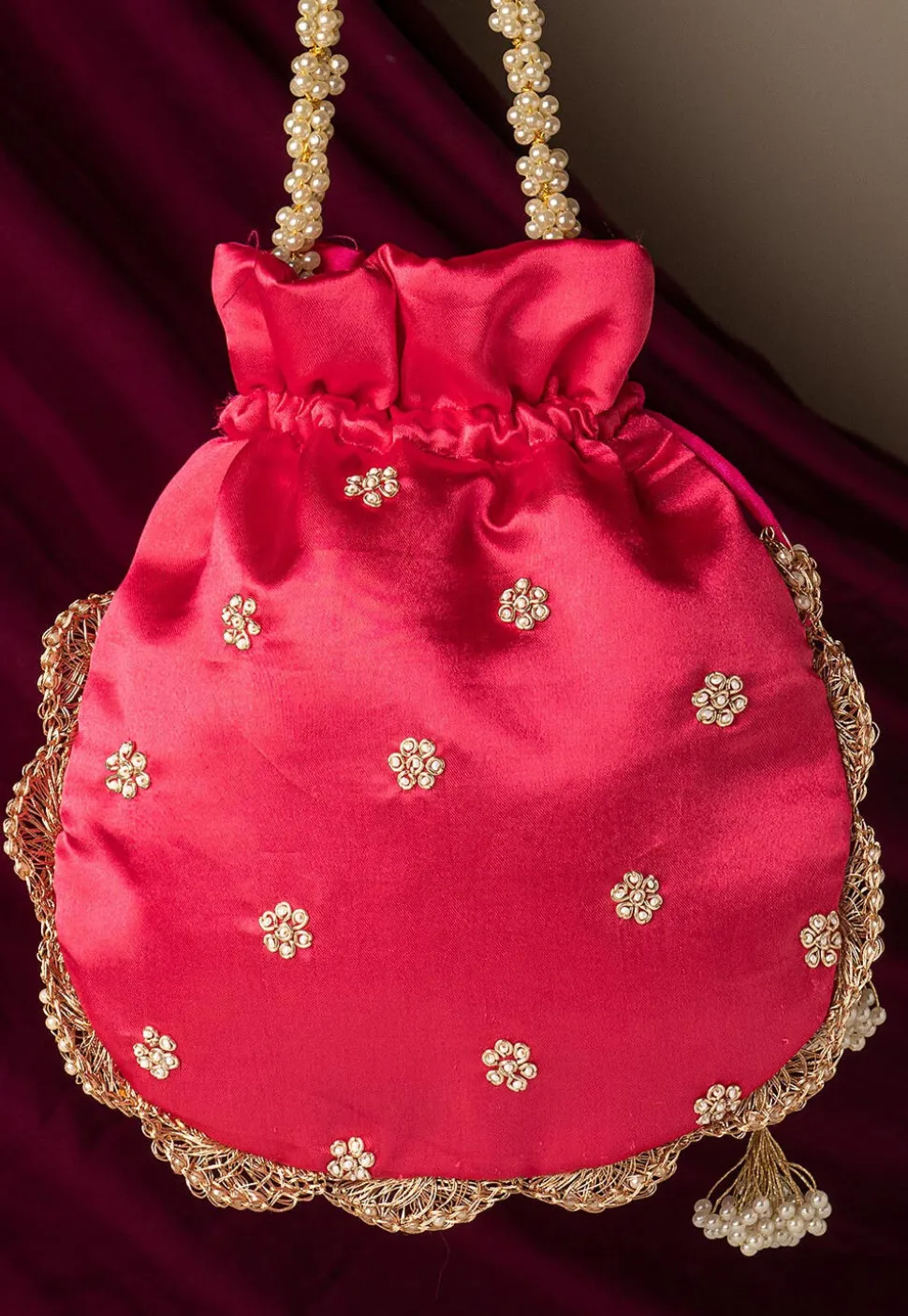 Hand Embroidered Art Silk Potli Bag in Fuchsia