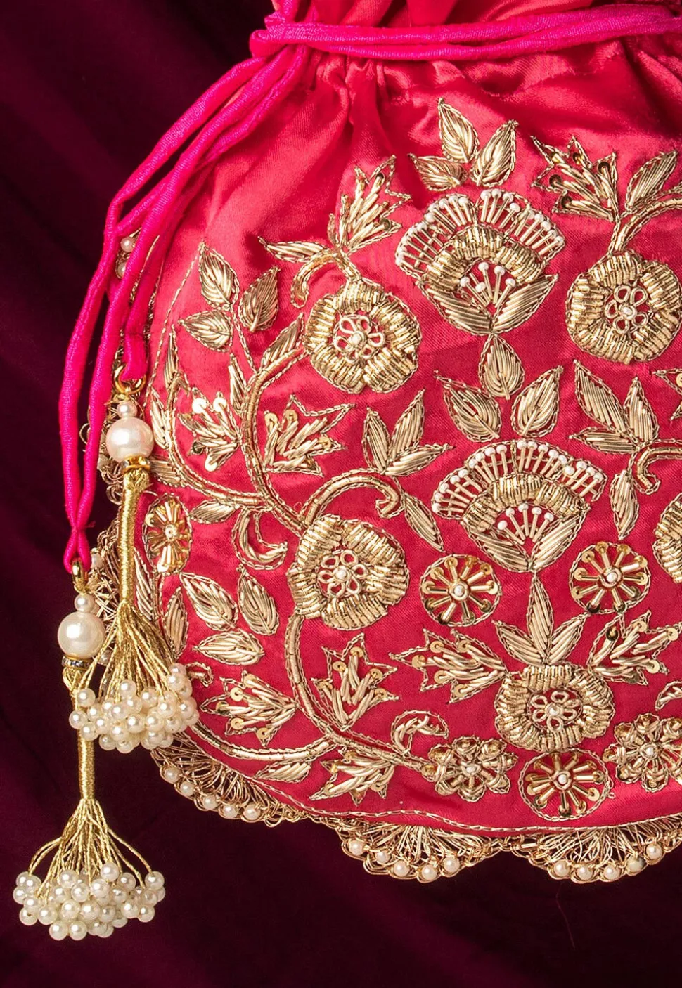 Hand Embroidered Art Silk Potli Bag in Fuchsia